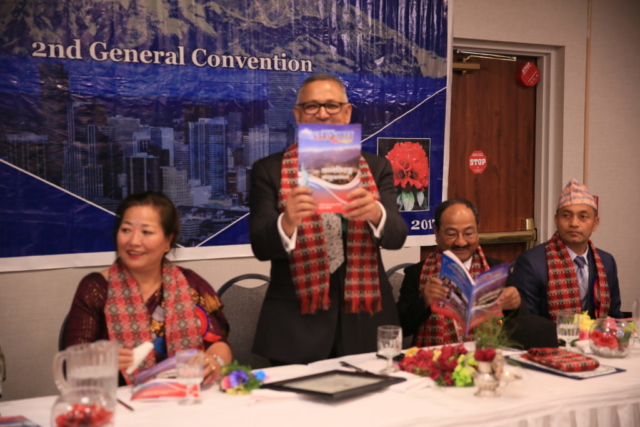 पुस्तक बिमोचन  गर्नु हुदै प्रमुख अथिति अमेरिकाको लागि नेपाली राजदुत महामहिम डा  अर्जुन कार्की